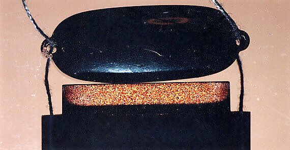 Case (Inrō) with Design of Shoki Wearing Wide Hat (obverse); Large Seal (reverse), Lacquer, roiro, gold and coloured hiramakie, takamakie; Interior: nashiji and fundame, Japan