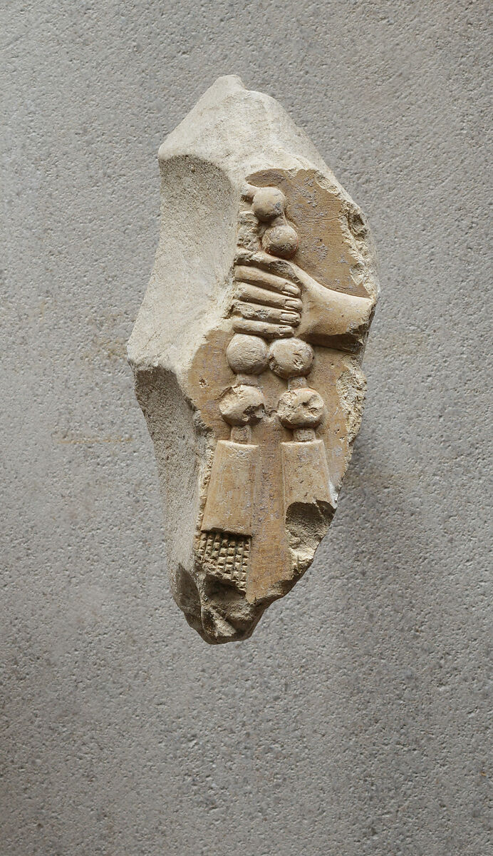 Relief of a hand with part of necklace - see 26.3.353-3, Limestone, paint 