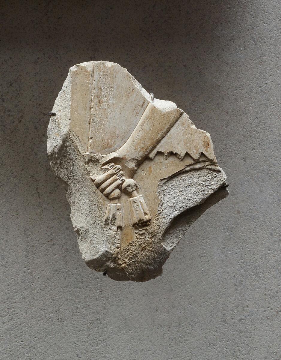 Relief of an attendant's hand holding a necklace - see 26.3.353-3, Limestone, paint 