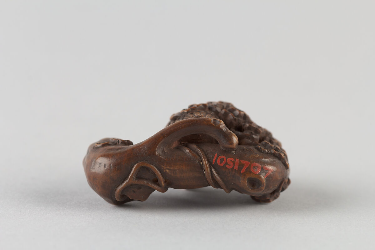 Netsuke of Owl on a Branch, Wood; inlaid glass eyes, Japan