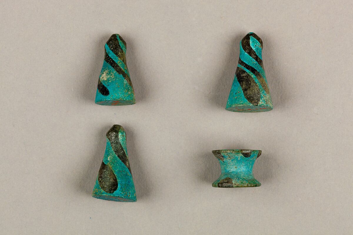 Seven Spool-Shaped Gaming Pieces, Faience