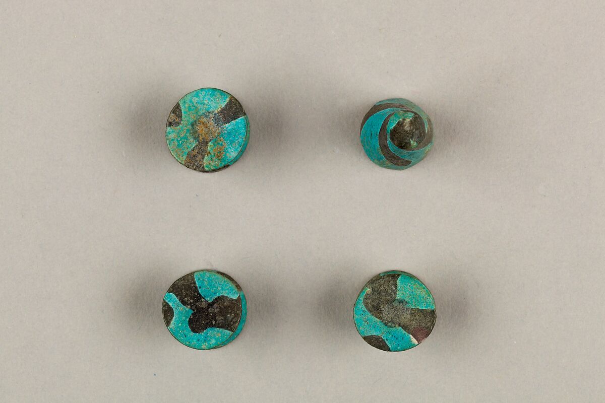 Seven Spool-Shaped Gaming Pieces, Faience