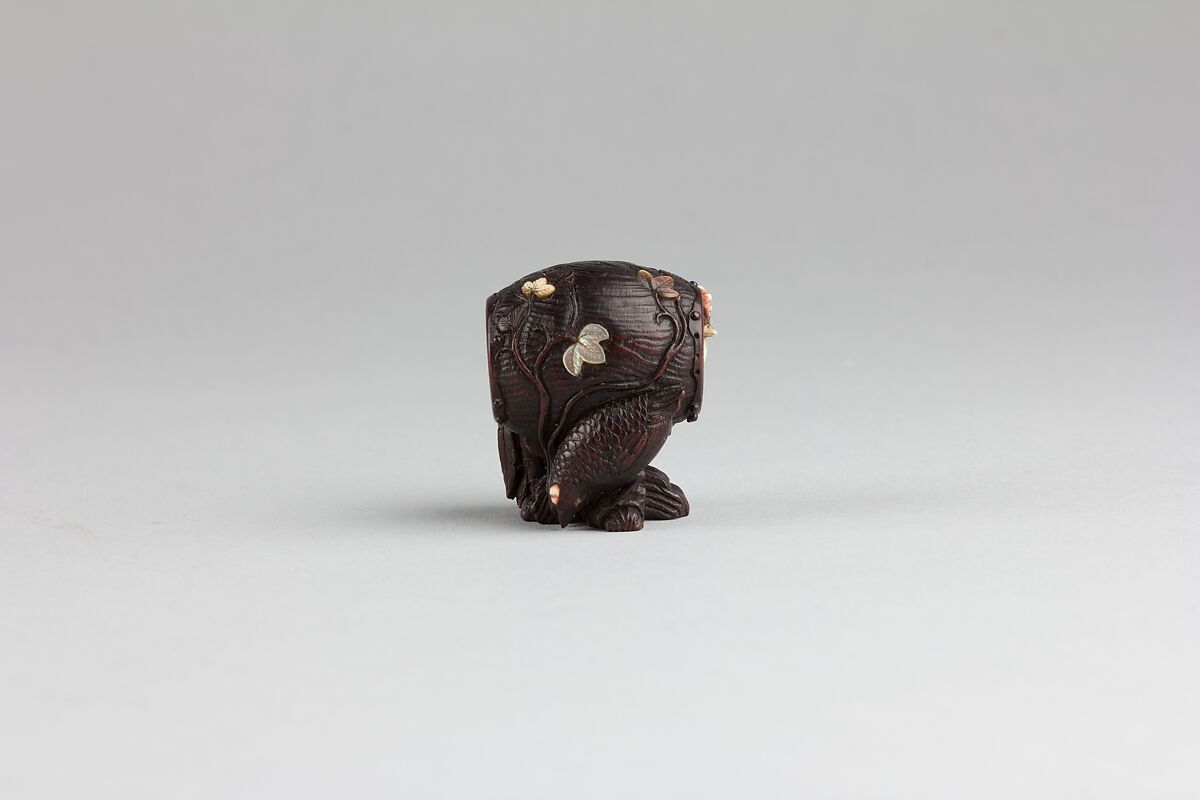 Netsuke, Wood inlaid with ivory and mother-of-pearl, Japan
