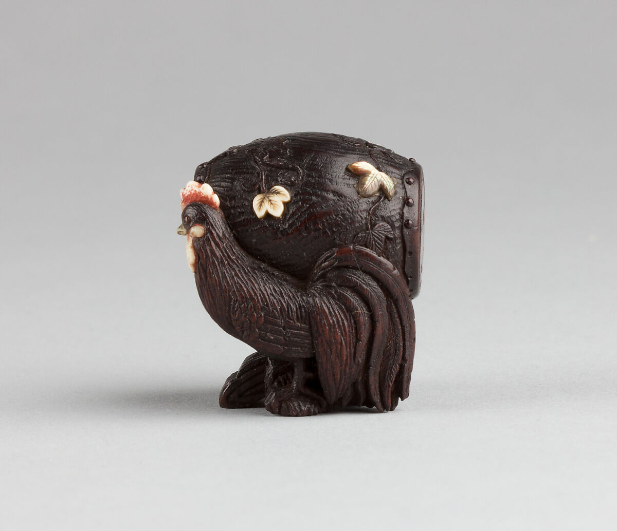 Netsuke, Wood inlaid with ivory and mother-of-pearl, Japan 