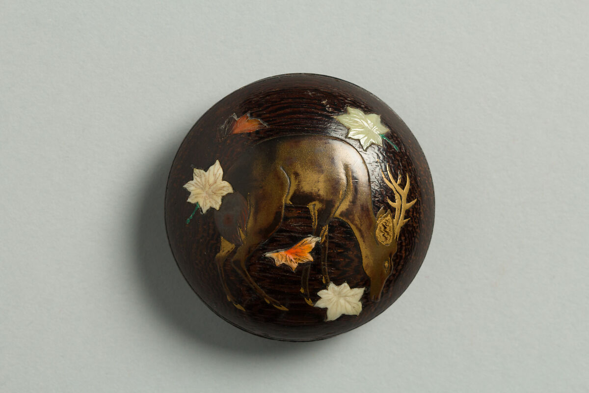 Netsuke with a Deer and Leaves, Wood decorated with gold lacquer and inlaid ivory, Japan 