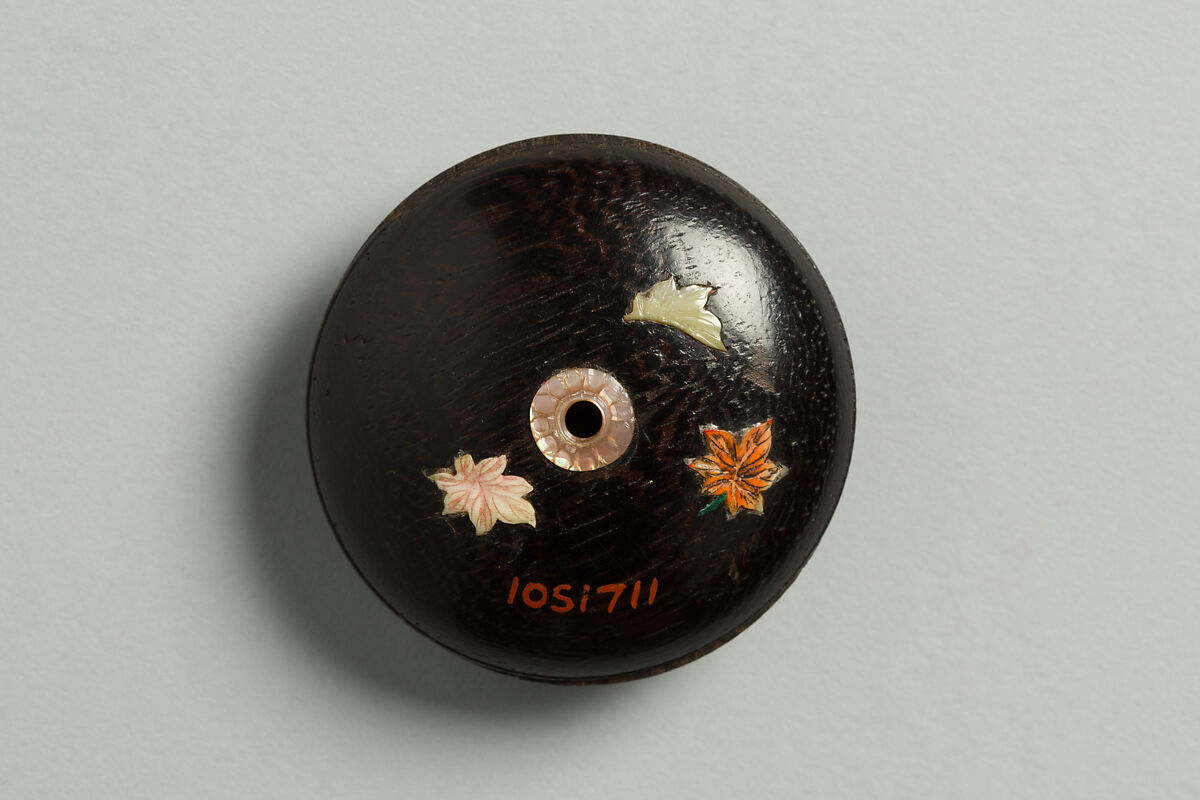 Netsuke with a Deer and Leaves, Wood decorated with gold lacquer and inlaid ivory, Japan