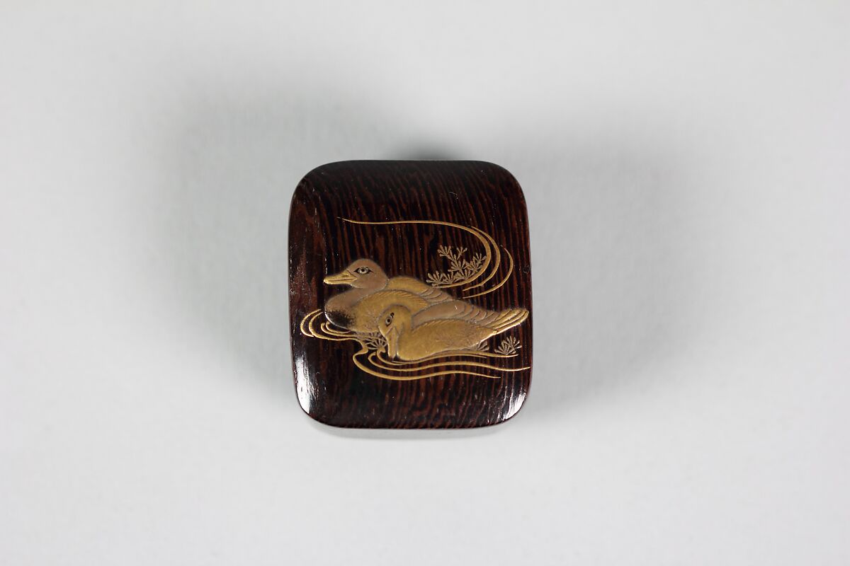 Netsuke of Two Ducks Swimming, Wood, duck in gold lacquer, Japan 