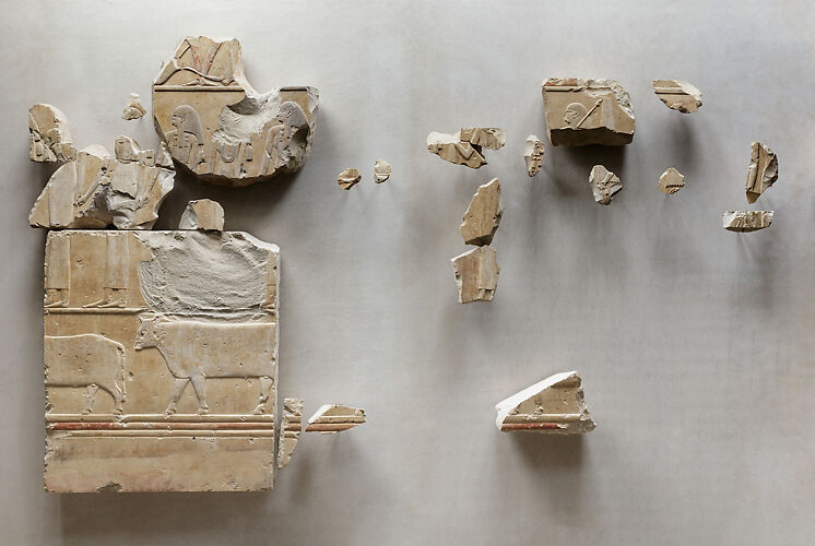 Relief fragments from the tomb of Neferu showing richly adorned attendants moving right to left