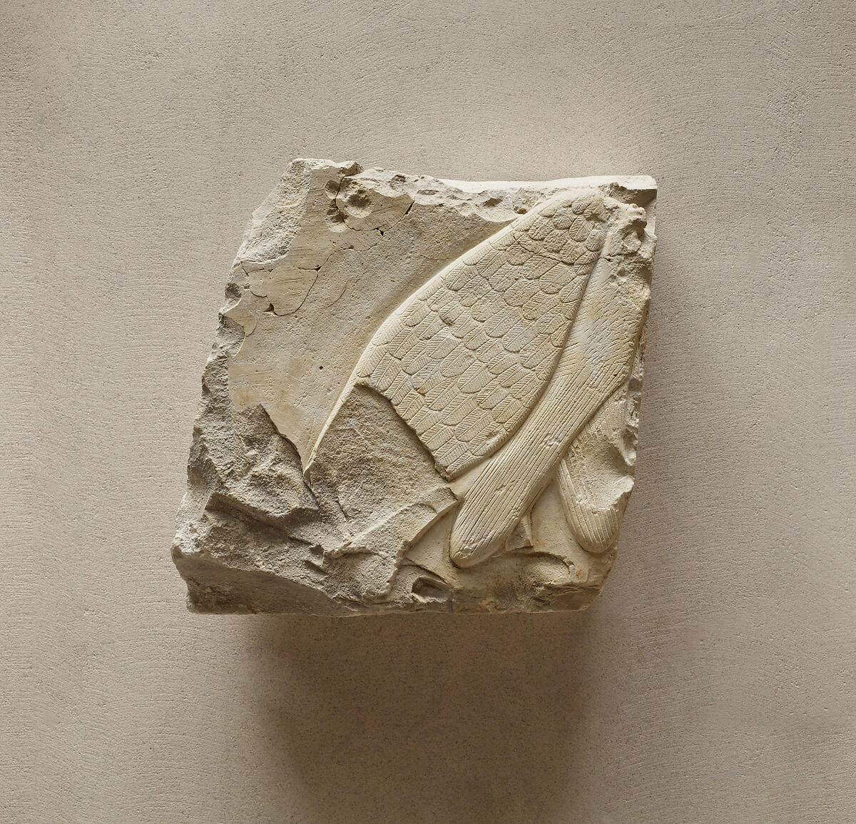 Relief fragment from a row of vulture figures, Limestone, paint 