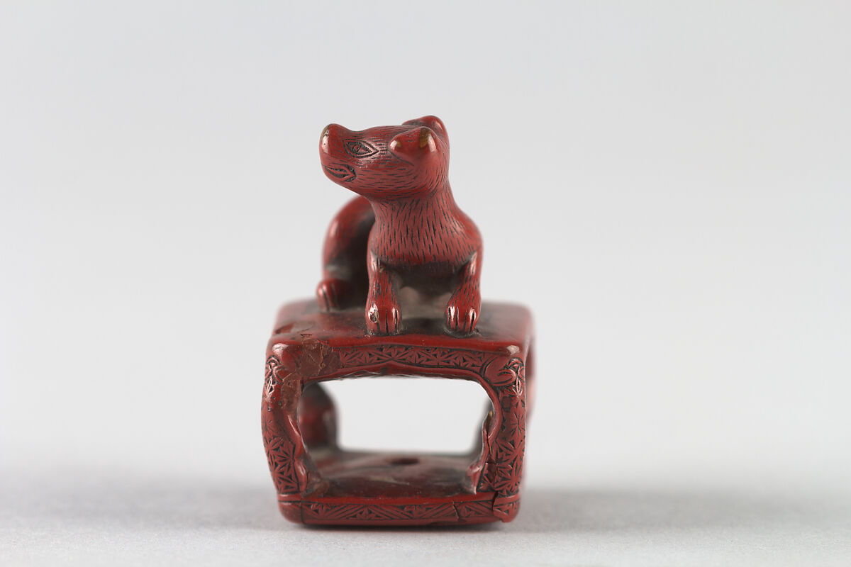 Netsuke of Dog on a Stand, Red lacquer, Japan