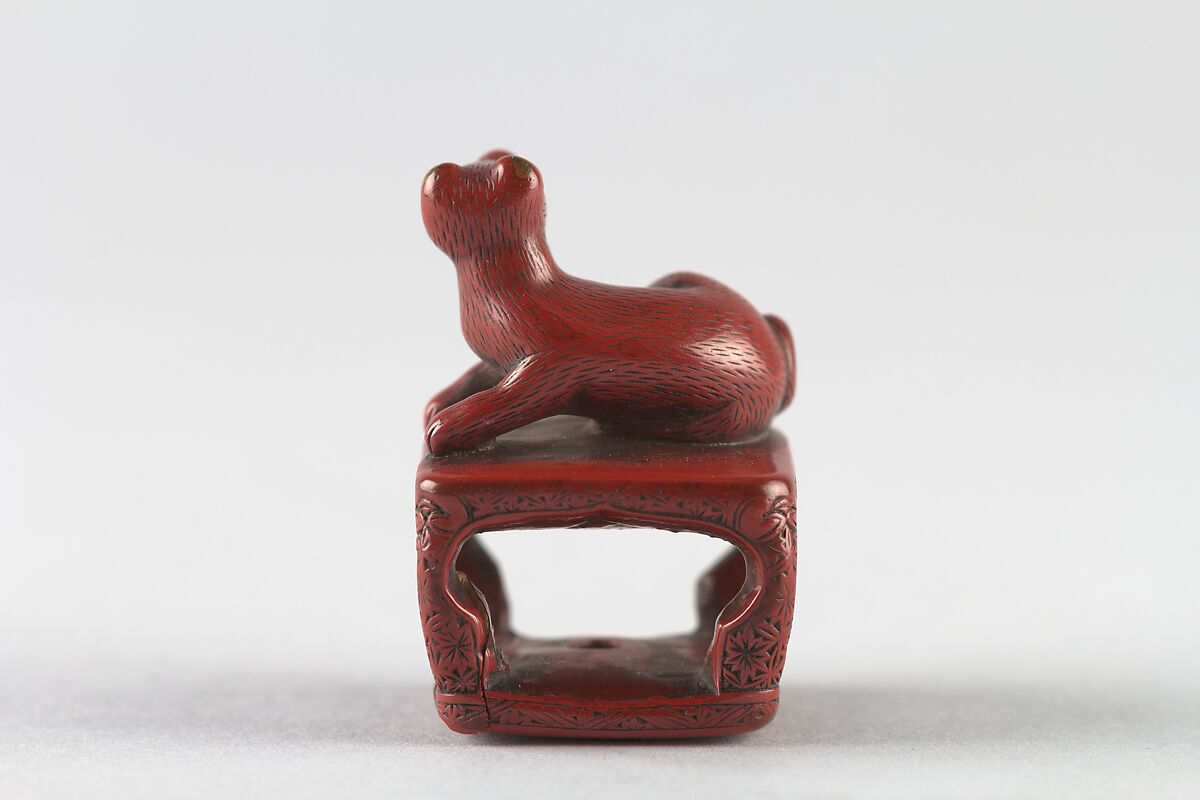 Netsuke of Dog on a Stand, Red lacquer, Japan
