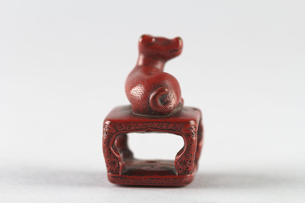 Netsuke of Dog on a Stand, Red lacquer, Japan