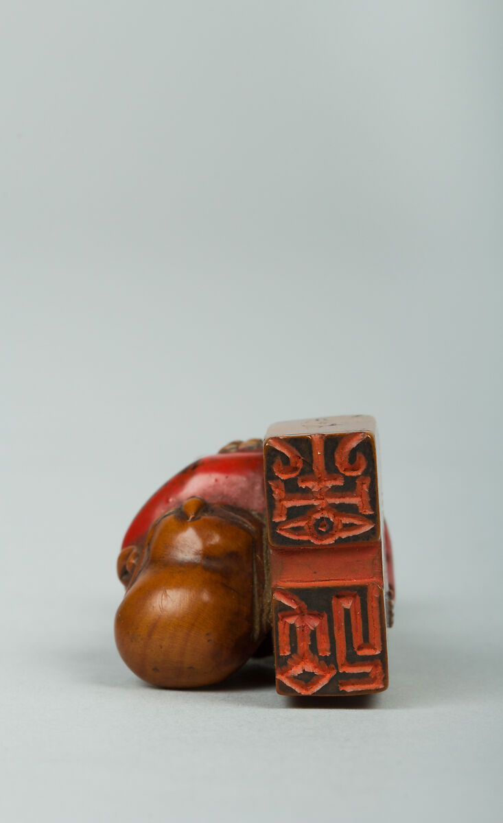 Netsuke of Tea Master, Wood and red lacquer, Japan