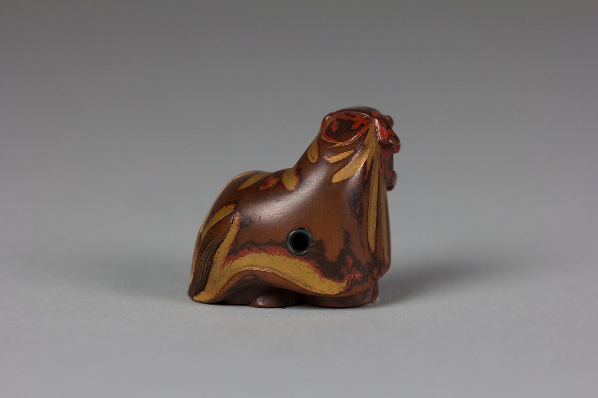 Netsuke, Lacquered wood inlaid with ivory, Japan