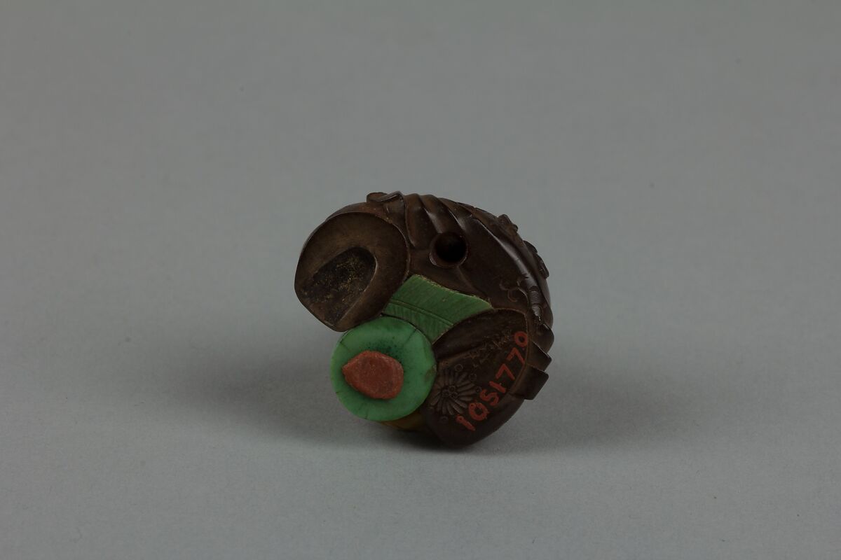 Netsuke of Seated Man with a Flower Pot, Wood and ivory, Japan