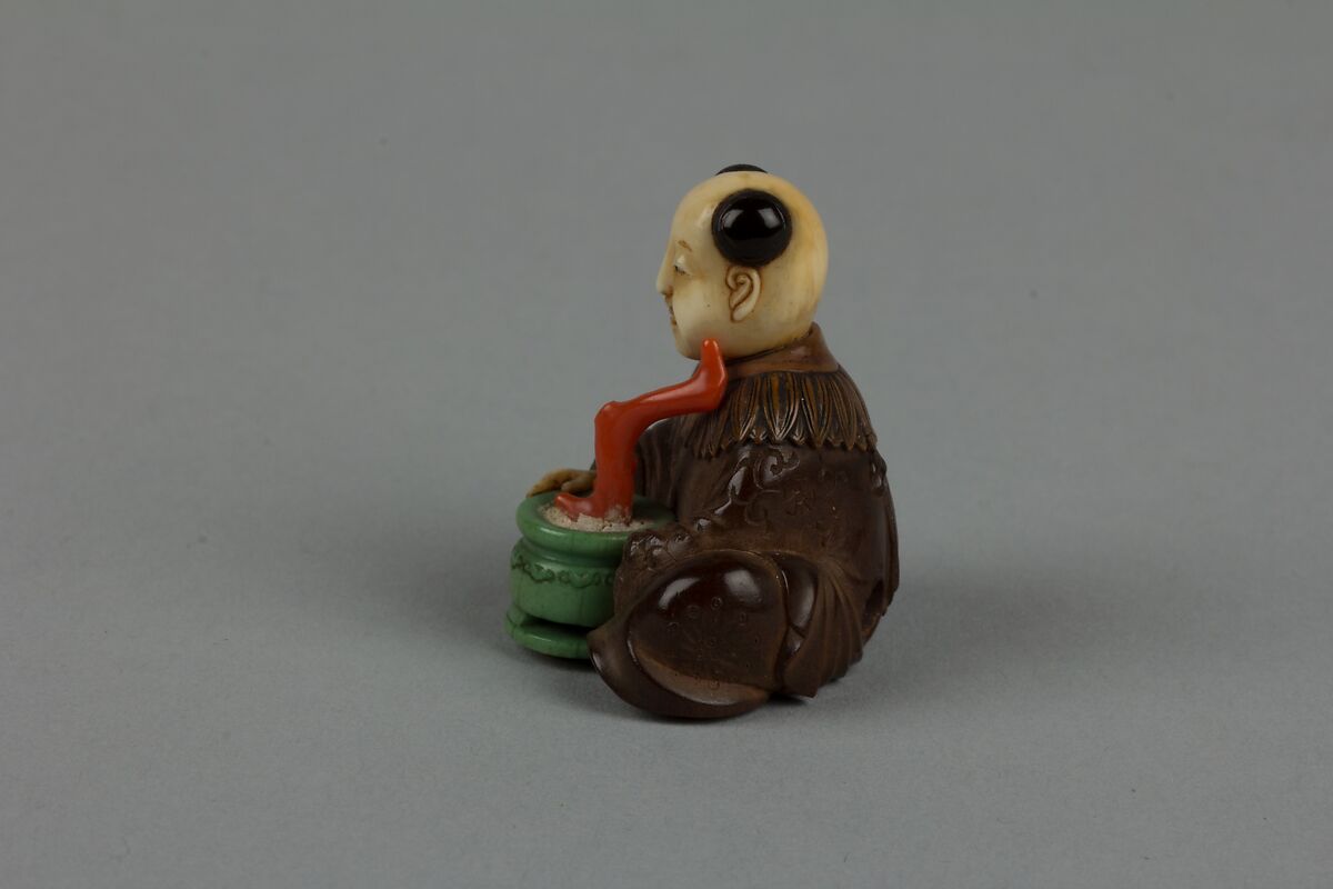 Netsuke of Seated Man with a Flower Pot, Wood and ivory, Japan