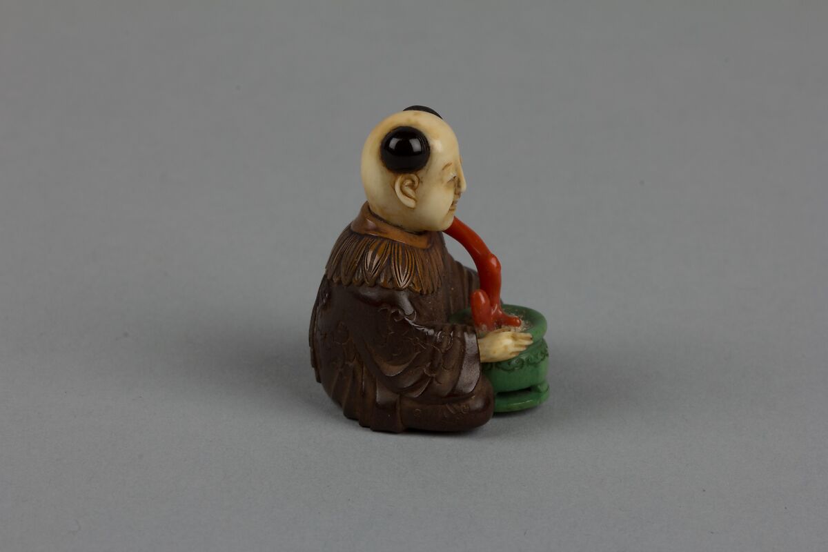 Netsuke of Seated Man with a Flower Pot, Wood and ivory, Japan