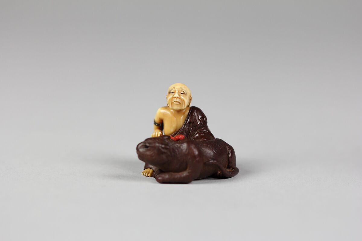 Netsuke of Old Man with a Tiger, Wood and ivory, Japan 