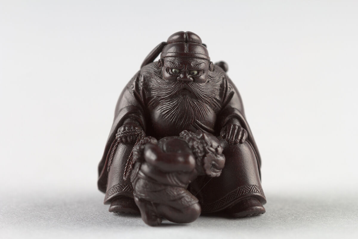 Netsuke of Man with a Demon on a Chain, Wood, Japan 