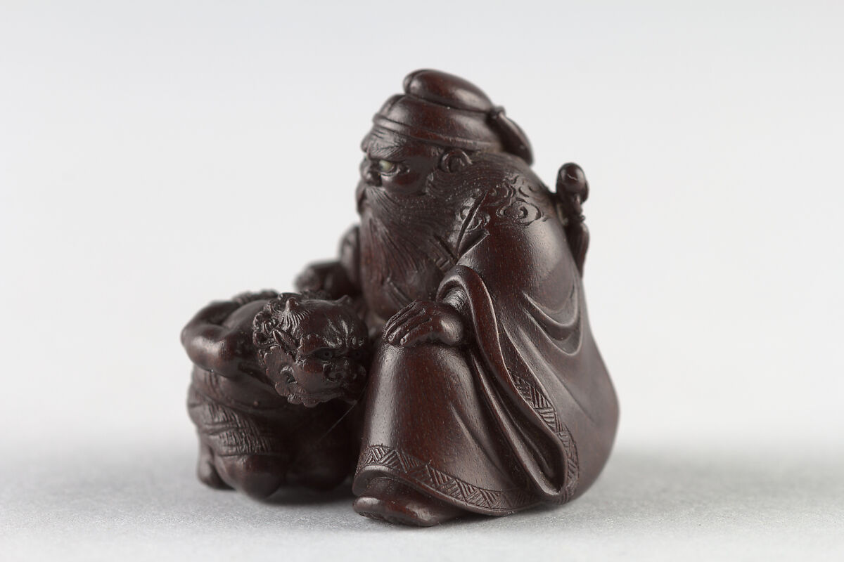Netsuke of Man with a Demon on a Chain, Wood, Japan
