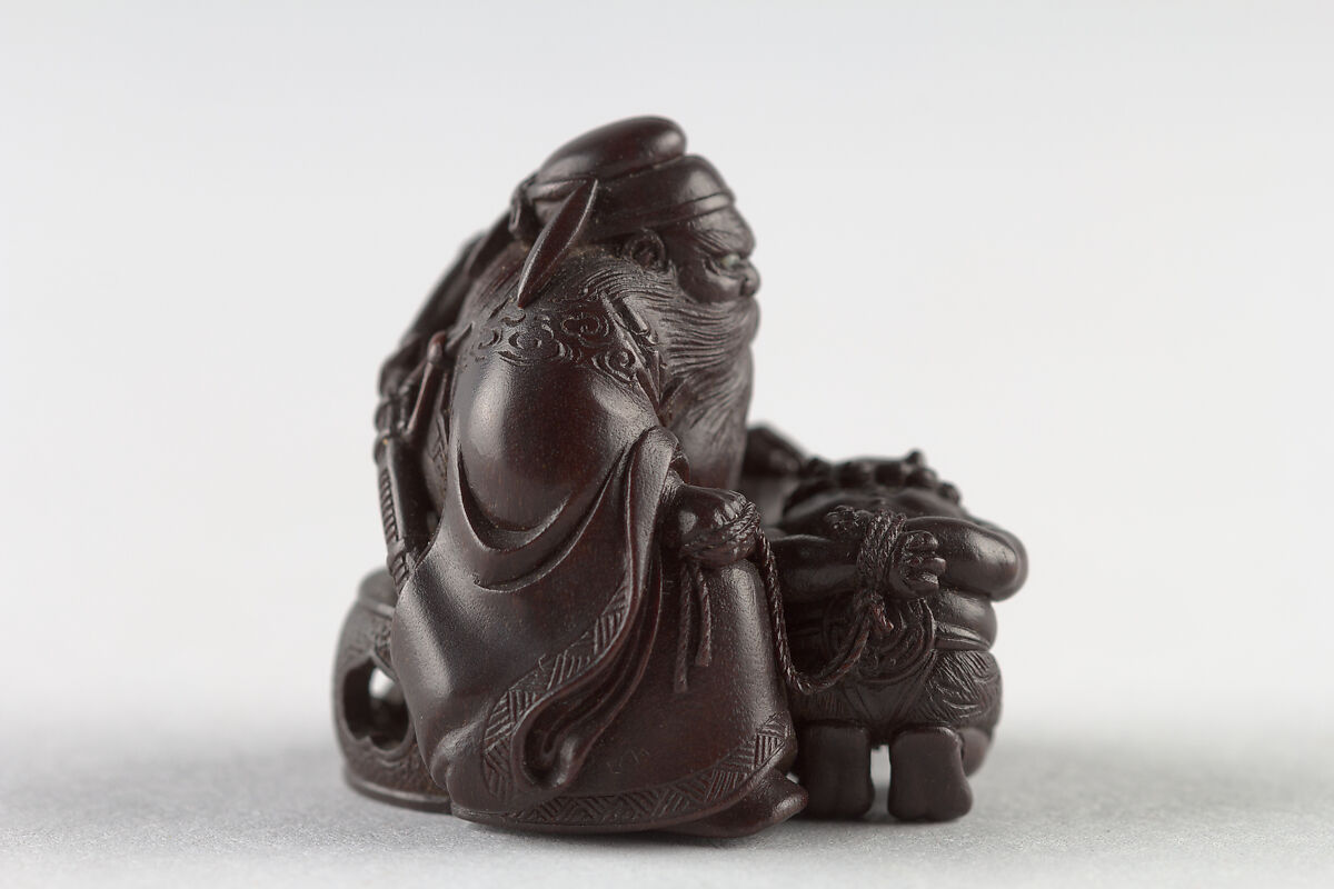 Netsuke of Man with a Demon on a Chain, Wood, Japan