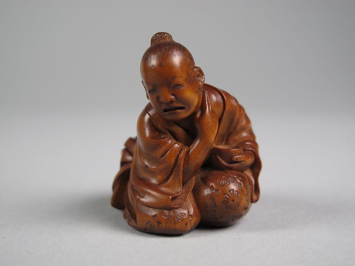 Netsuke of Man Applying Salve, Wood, Japan 