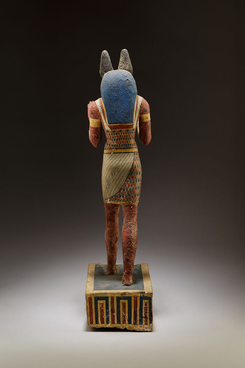 Statuette of a canid-headed god, probably Anubis, Plastered and painted wood