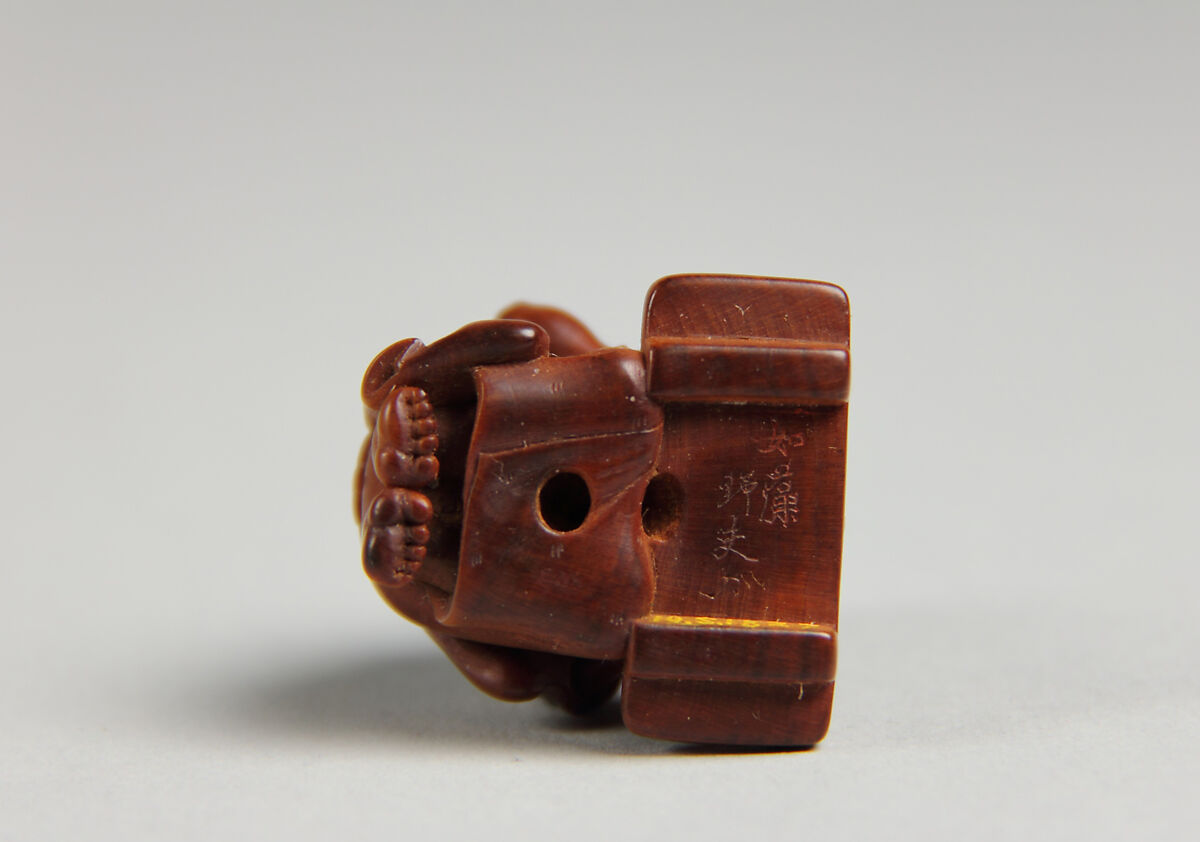 Netsuke of Man Cutting Pumpkin, Wood, Japan