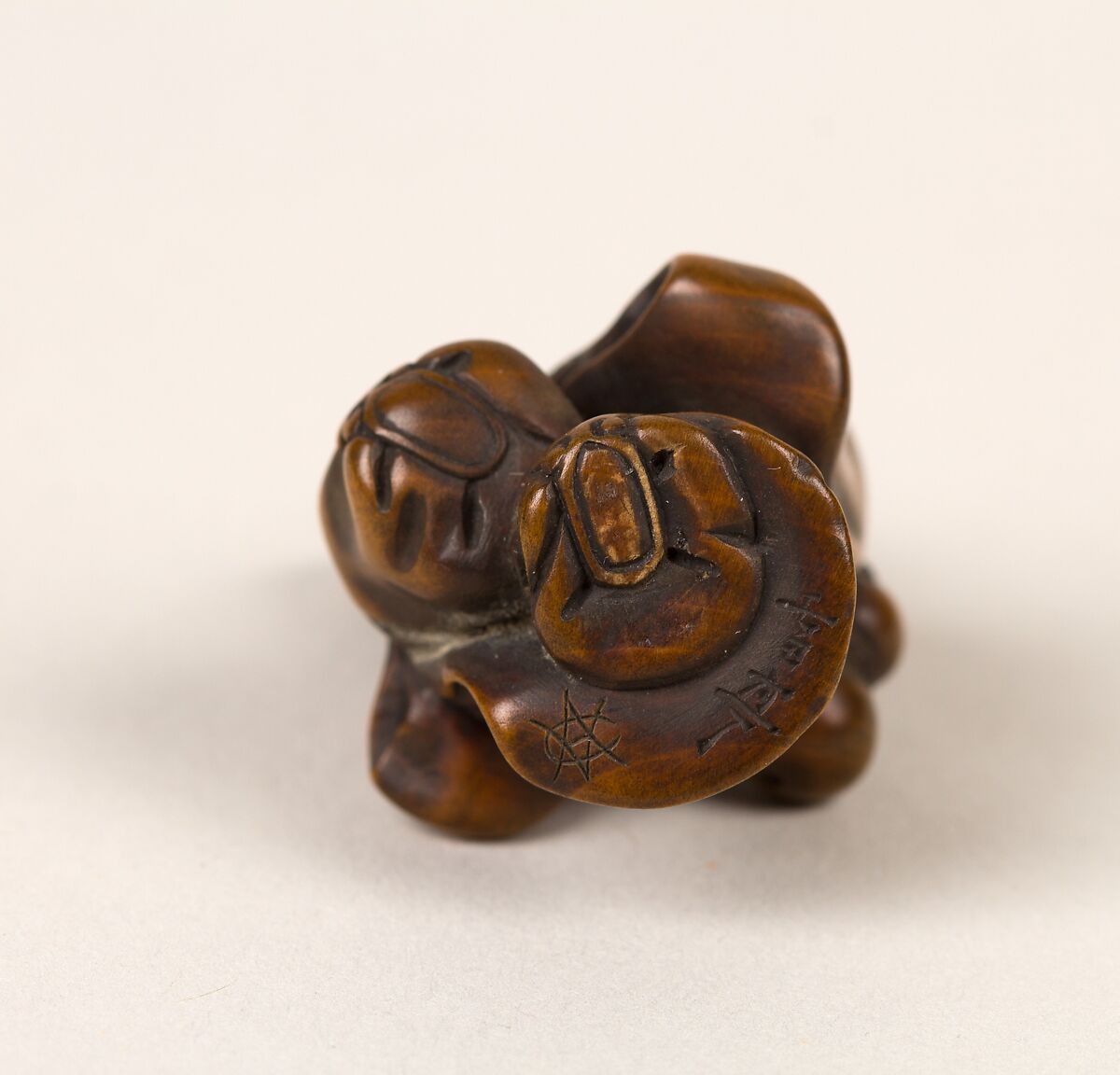 Netsuke of Old Man with a Fan, Wood, Japan