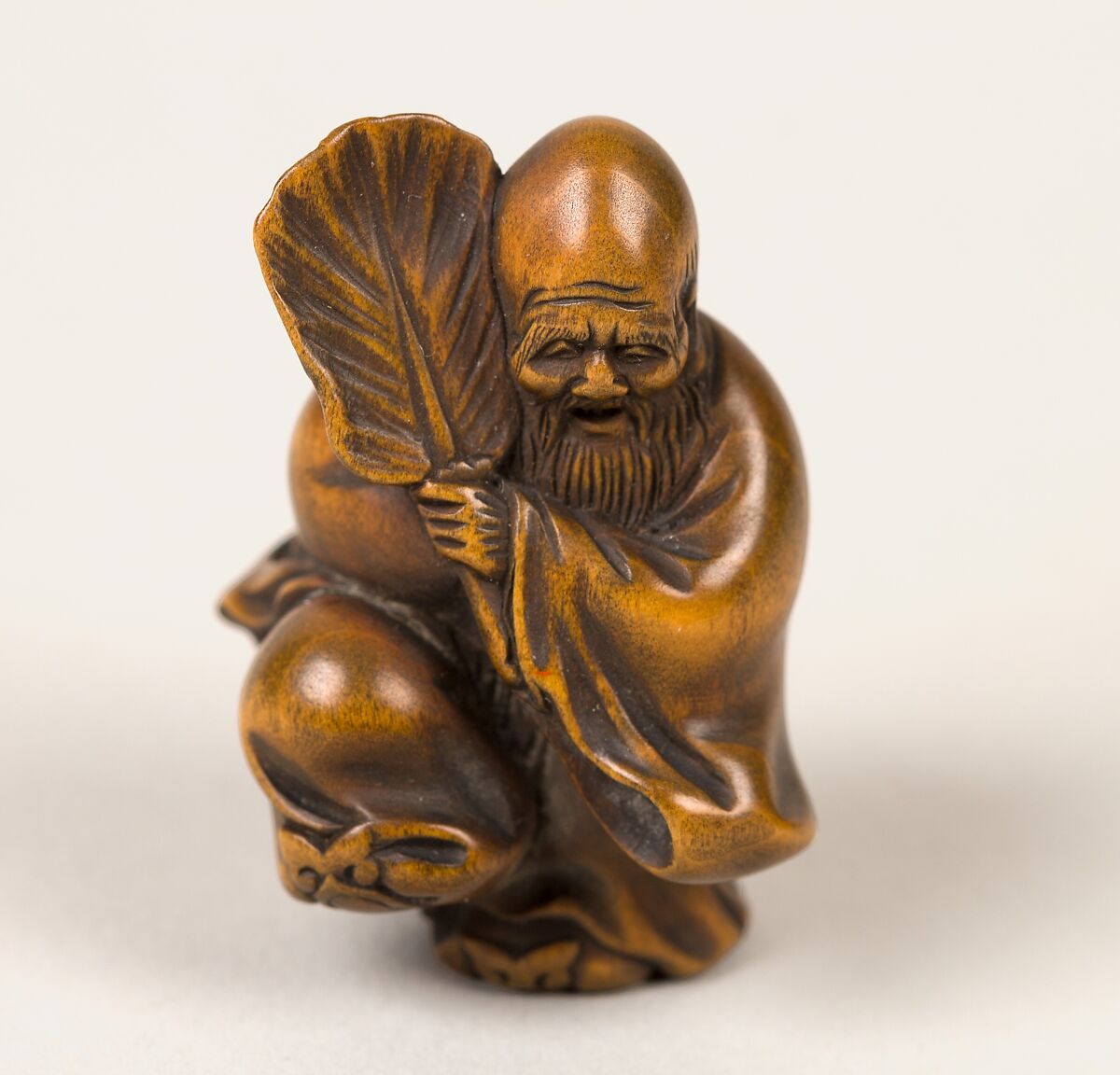 Netsuke of Old Man with a Fan, Wood, Japan 