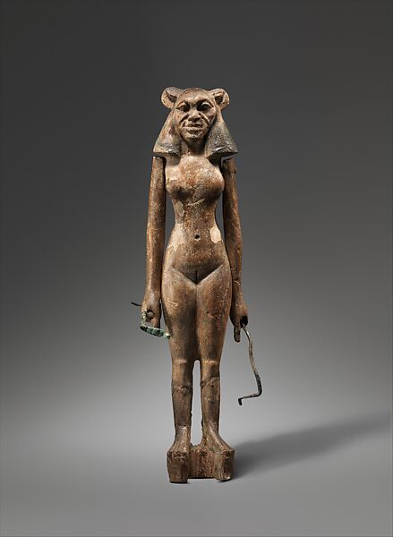 Female Leonine Figurine Holding Snakes, Wood 