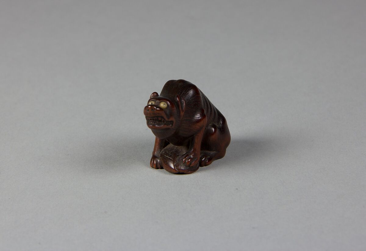 Netsuke of a Wolf, Wood; glass eyes, Japan