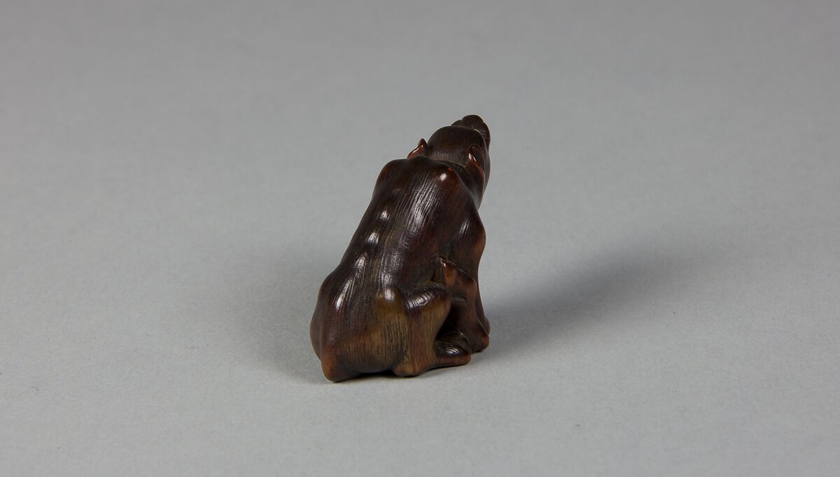 Netsuke of a Wolf, Wood; glass eyes, Japan