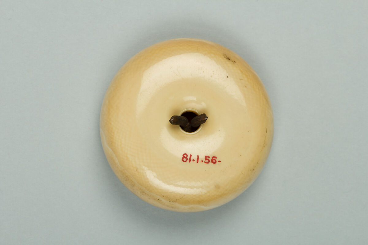 Netsuke, Ivory with bronze disk inlaid with gold, Japan