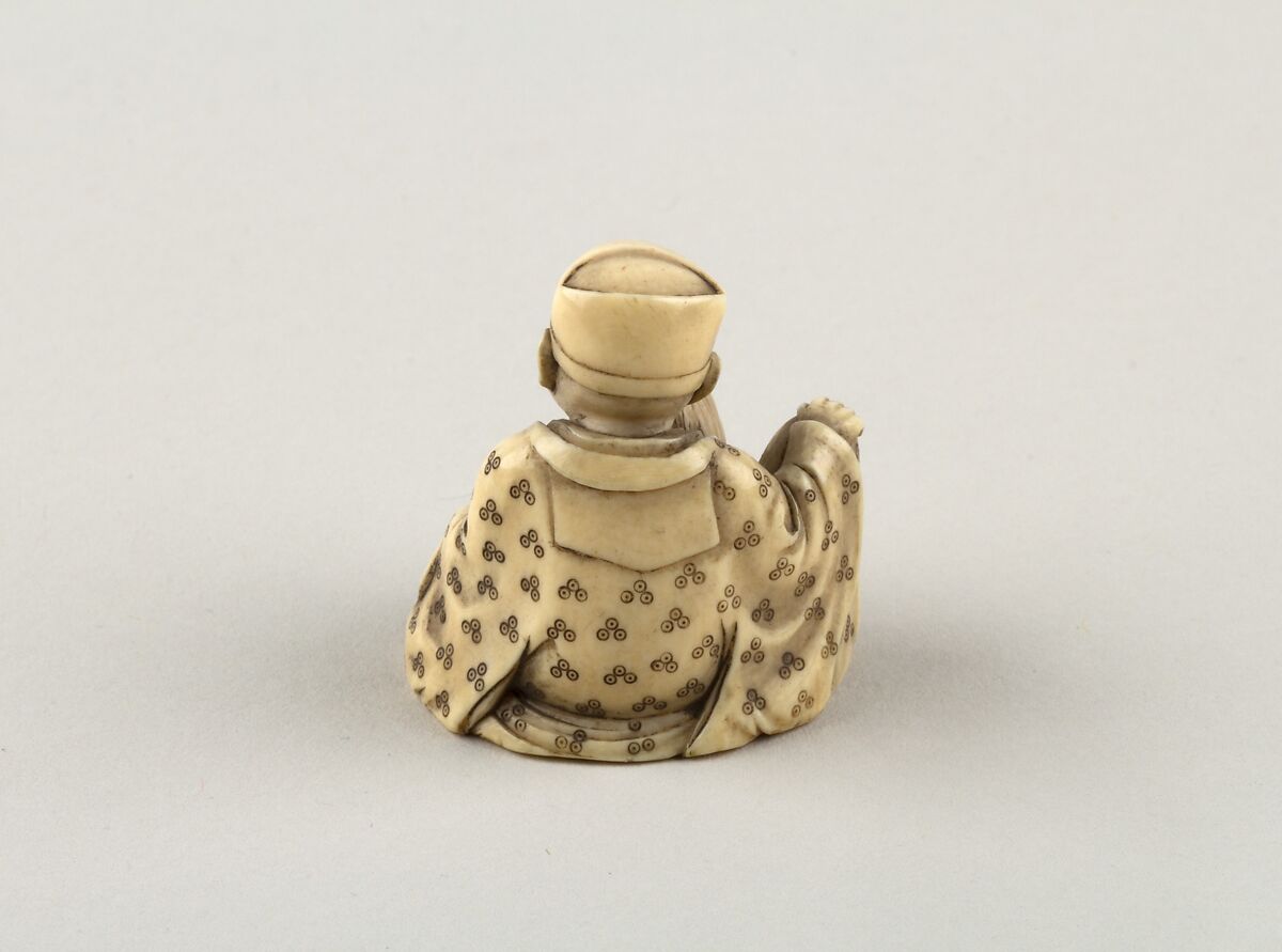 Seated figure of a Man with Dog, Ivory, Japan