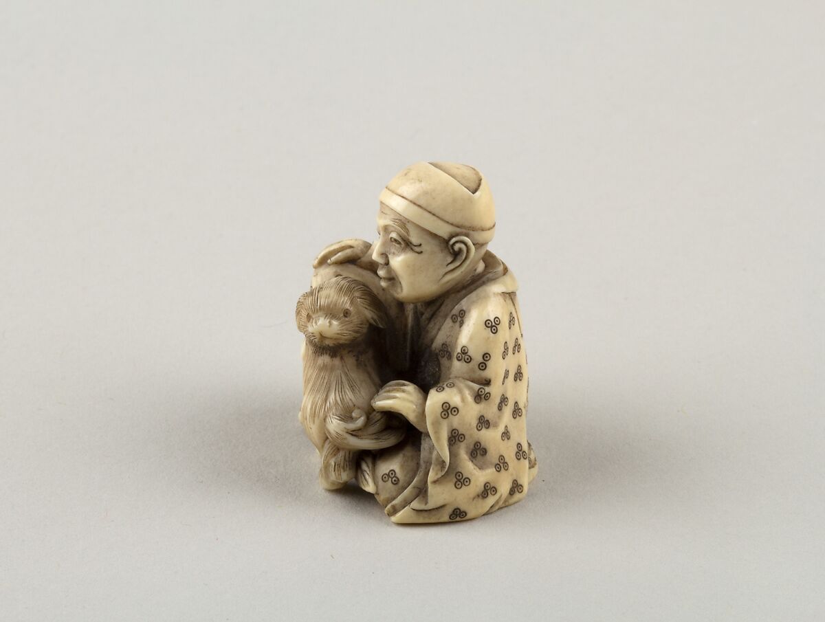 Seated figure of a Man with Dog, Ivory, Japan