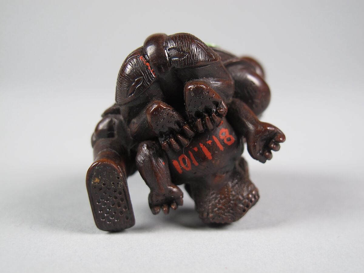 Figure of a Man Killing a Demon, Wood; inlaid eyes, Japan