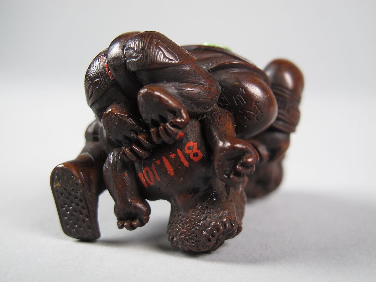 Figure of a Man Killing a Demon, Wood; inlaid eyes, Japan