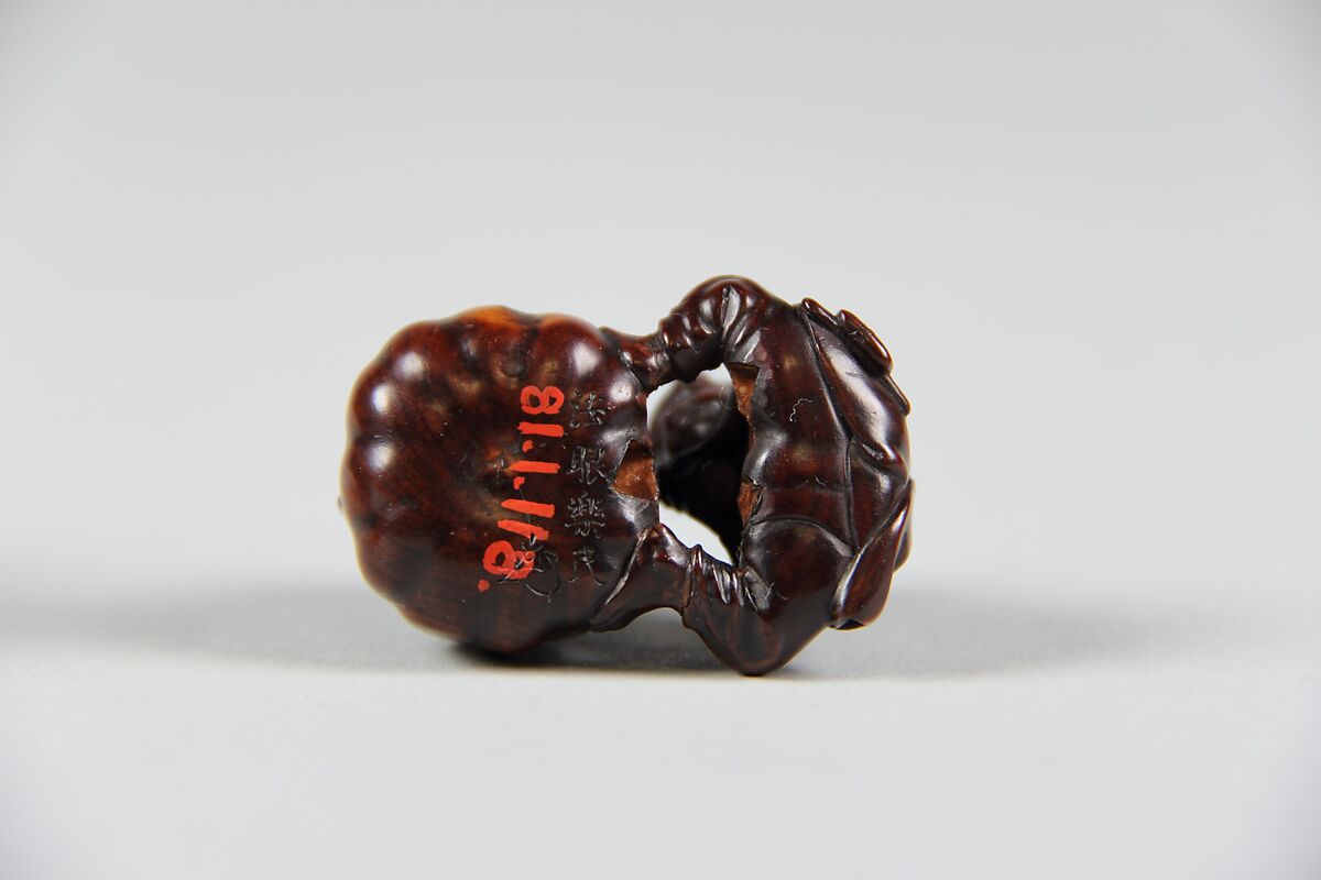 Netsuke of Boy Cutting a Gourd, Wood, Japan