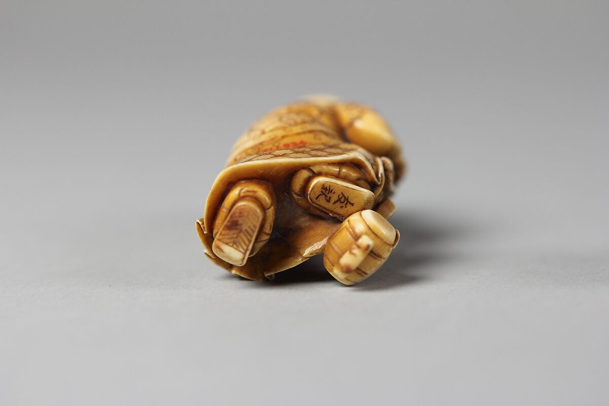 Netsuke of Figure of Daikoku with a Rat on His Mallet, Ivory, Japan