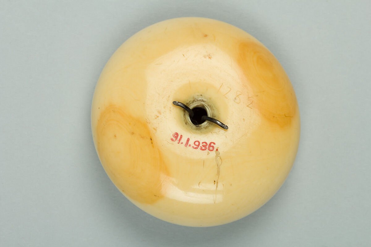 Netsuke of Two Tengu Dancing, Ivory with metal disc, Japan