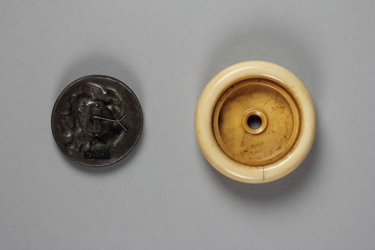 Netsuke of Daikoku and His Bag Dancing with a Man, Ivory with metal disc, Japan