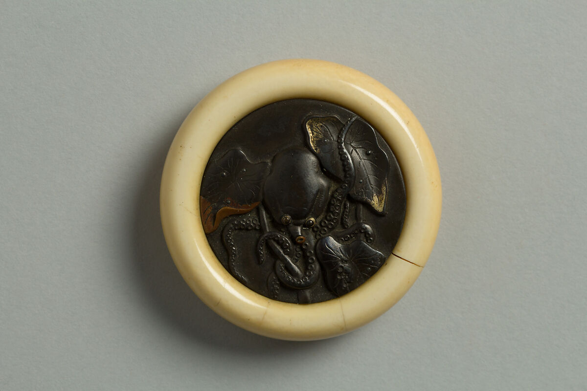 Netsuke Decorated with an Octopus in Lotus Leaves, Ivory with metal disc, Japan 