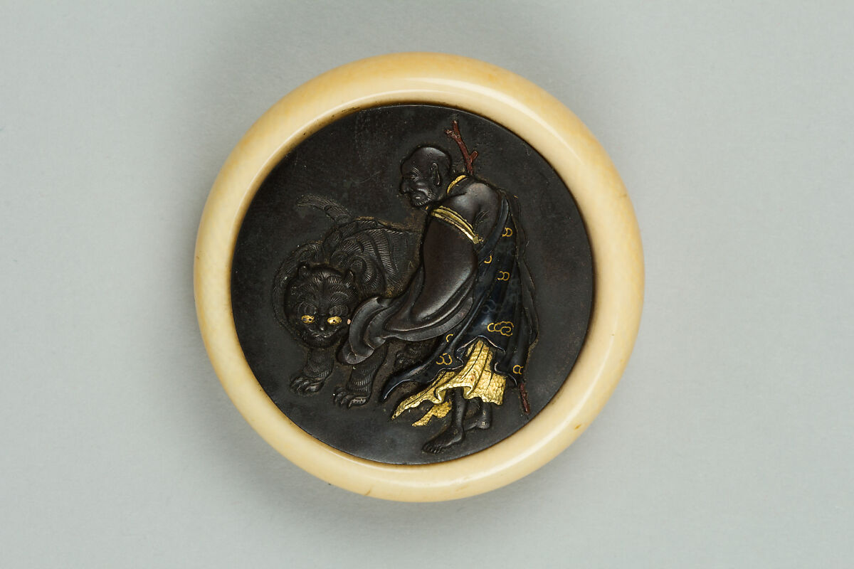 Netsuke of Luohan with a Tiger, Ivory with metal disc, Japan 