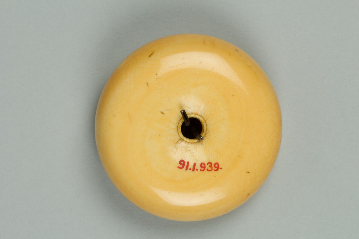 Netsuke of Luohan with a Tiger, Ivory with metal disc, Japan