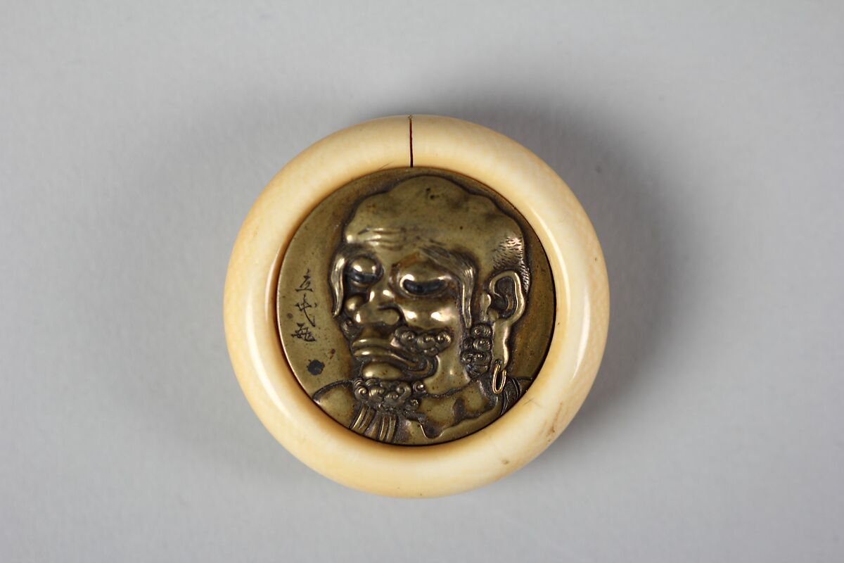 Netsuke of Luohan, Ivory with metal disc, Japan 