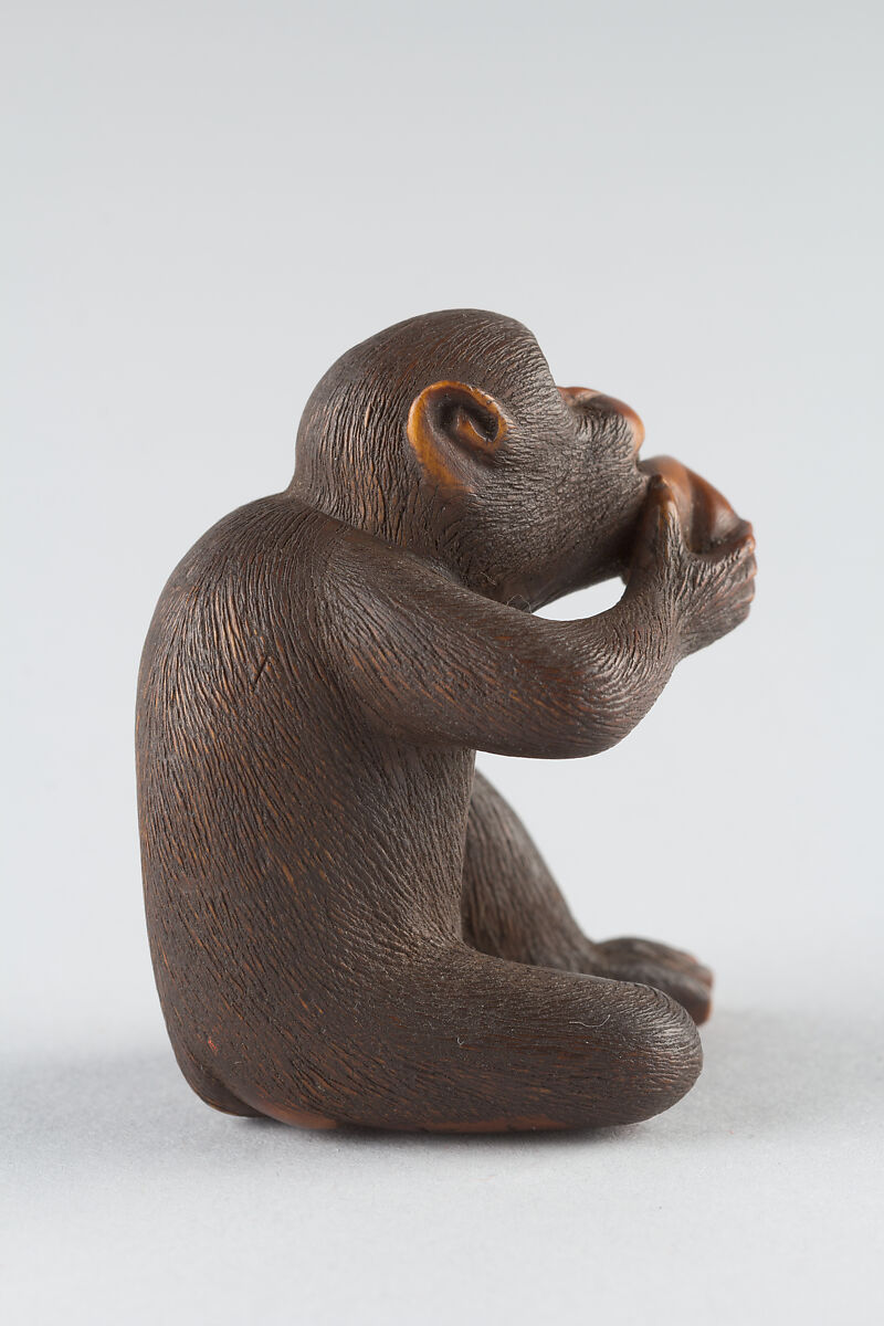 Netsuke of Monkey Eating a Peach, Wood, Japan