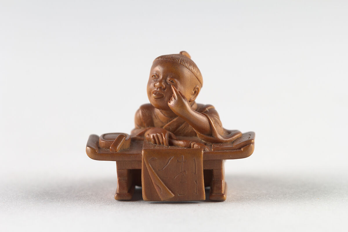 Netsuke of Boy Writing, Wood, Japan 