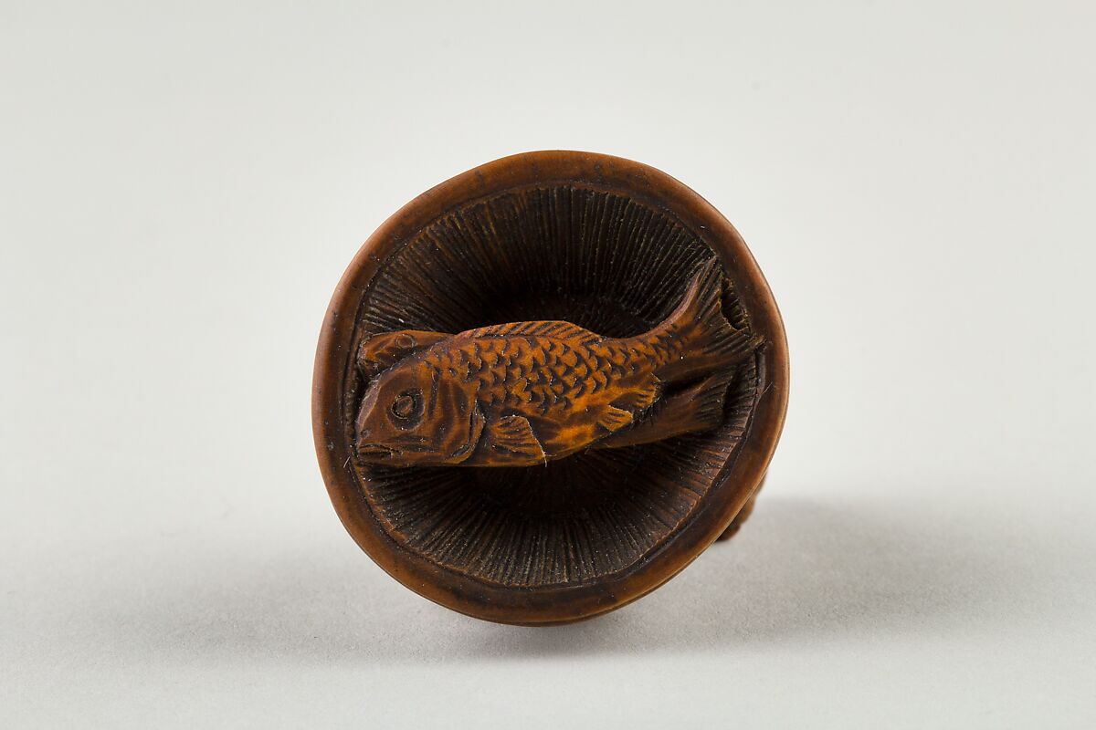 Netsuke of Cat Lying on a Bowl, underneath which is a Fish, Wood, Japan