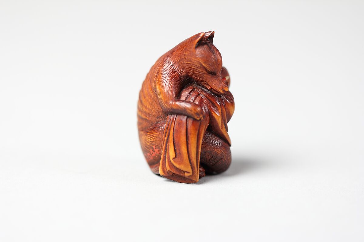 Netsuke of Fox Holding Baby and with Brush in Mouth from the Kabuki Play "Shinoda Zuma, Kuzonoha", Wood, Japan